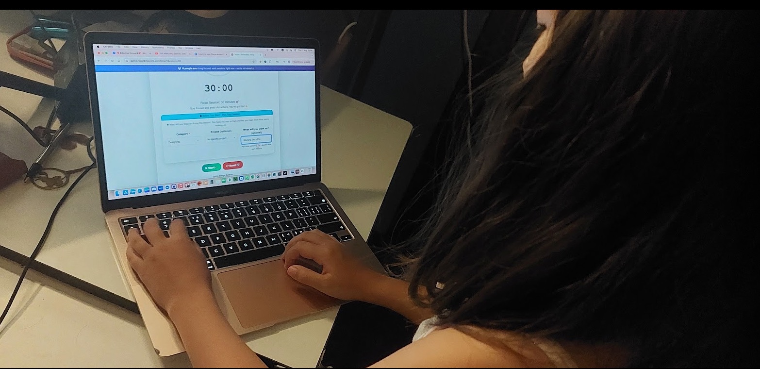 Maggie using RegardingWork Game on her laptop